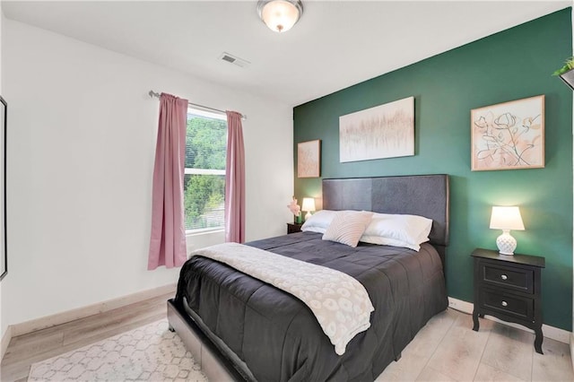 bedroom featuring light wood-type flooring