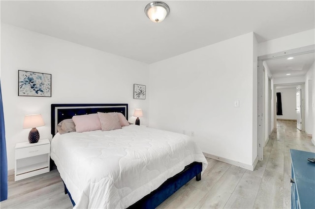 bedroom with light hardwood / wood-style flooring