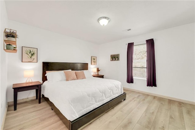 bedroom with light hardwood / wood-style floors