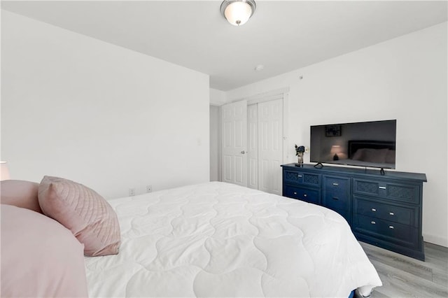 bedroom with light wood-type flooring