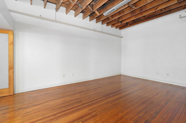 empty room with wood-type flooring