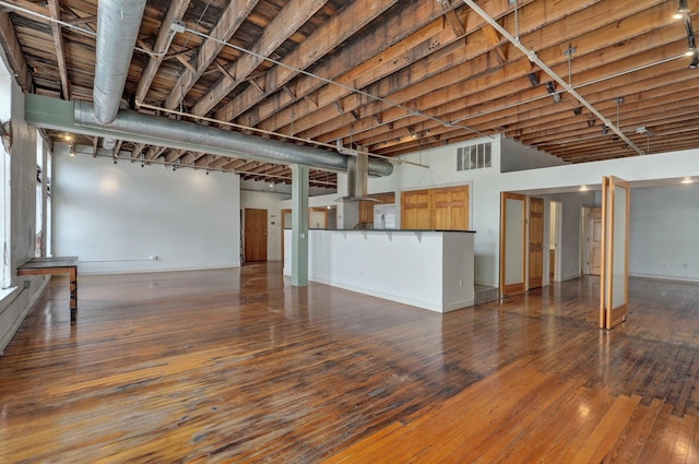 basement with hardwood / wood-style flooring