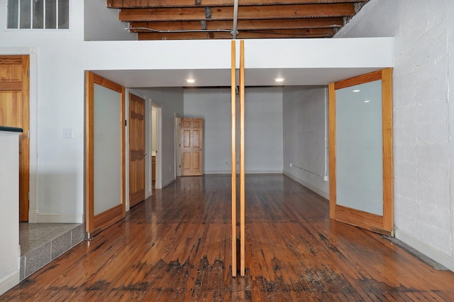 basement featuring dark hardwood / wood-style flooring