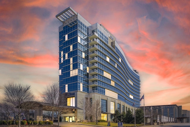 view of outdoor building at dusk