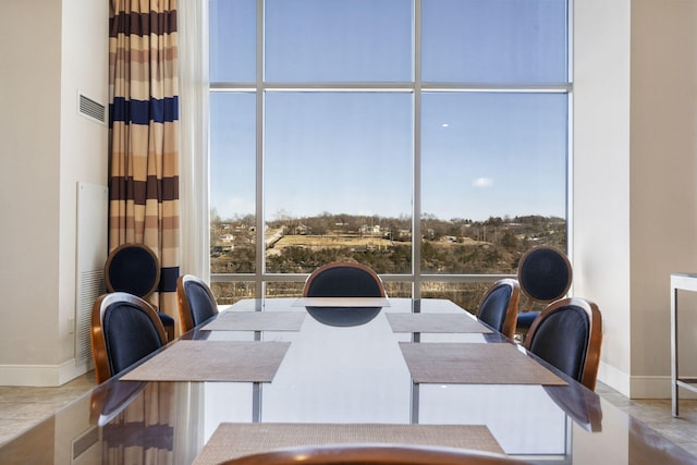 dining area with a wall of windows