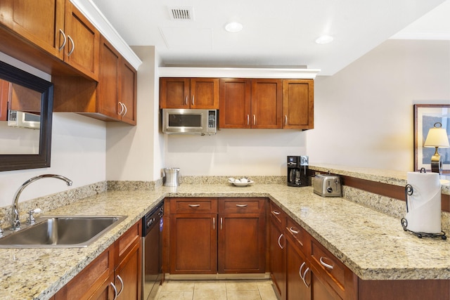 kitchen with stainless steel appliances, kitchen peninsula, sink, and light tile patterned floors