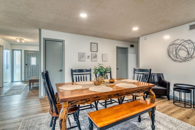 26416 State Highway Yy, Shell Knob, MO 65747 - dining space featuring a textured ceiling, visible vents, and light wood-style floors
