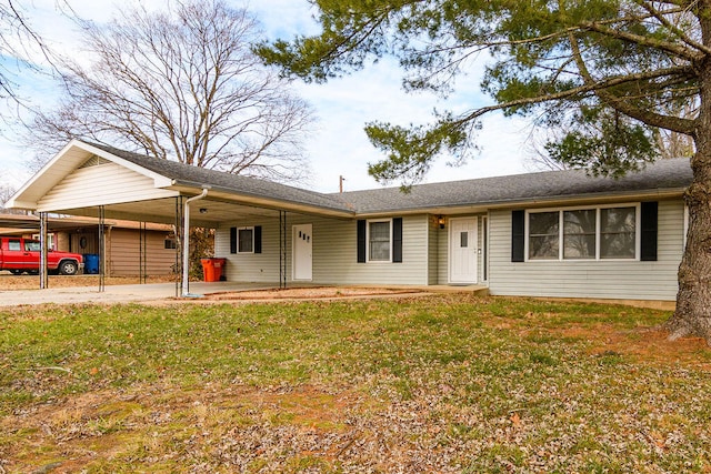 single story home featuring a front lawn and a carport