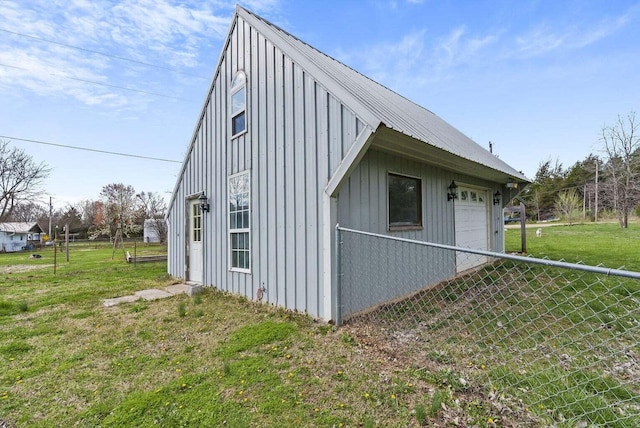 view of side of home with a lawn