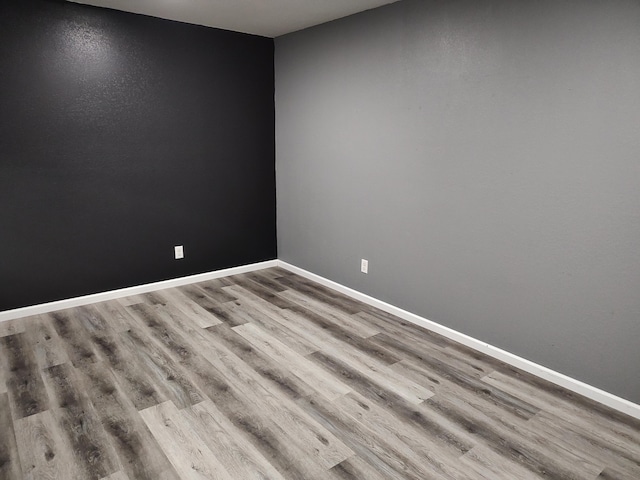 unfurnished room featuring light hardwood / wood-style floors