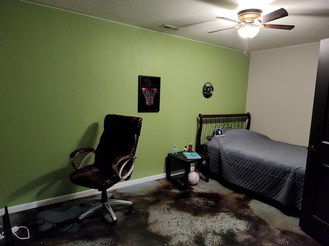 bedroom featuring concrete floors, a textured ceiling, and ceiling fan