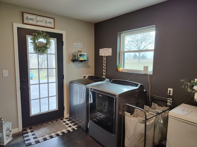 washroom with washing machine and dryer