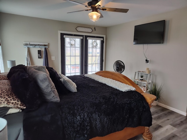 bedroom with ceiling fan and hardwood / wood-style floors