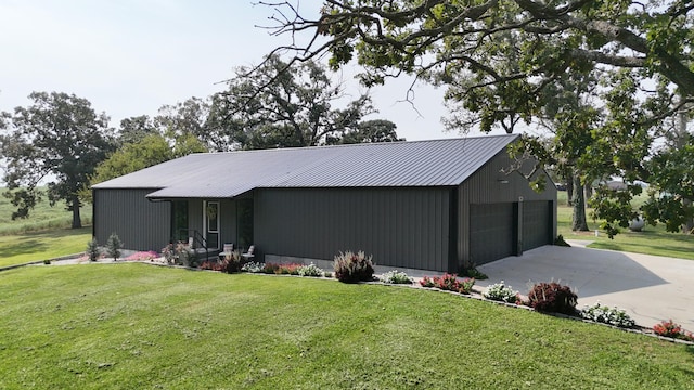 exterior space featuring a garage and a front lawn