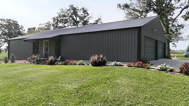 exterior space with a lawn and a garage