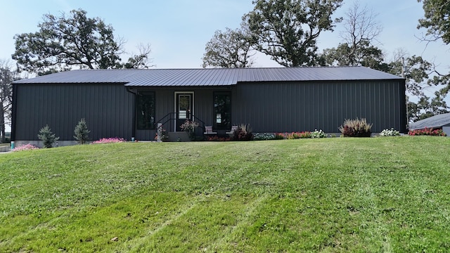 ranch-style house with a front lawn