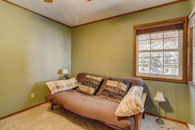 sitting room with crown molding and carpet