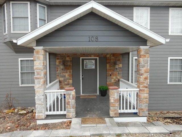 property entrance featuring covered porch