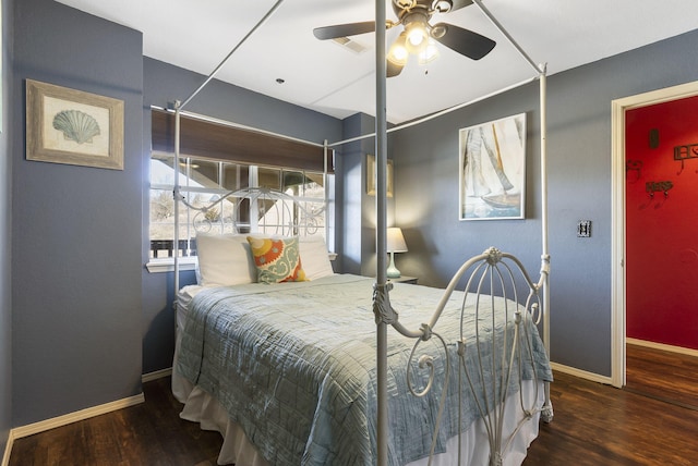 bedroom featuring ceiling fan and dark hardwood / wood-style floors