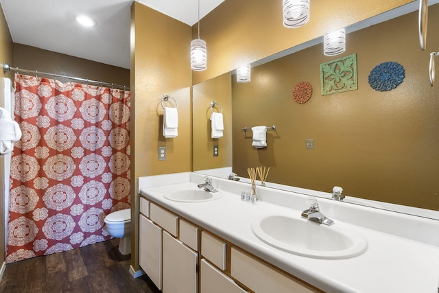 bathroom featuring vanity, hardwood / wood-style floors, toilet, and a shower with shower curtain