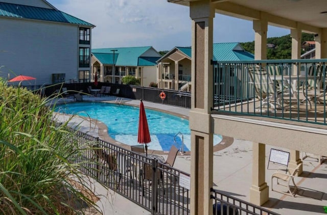 135 Upper Emerald Bay Cir Unit G-13, Hollister, MO 65672 - community pool with a patio and fence