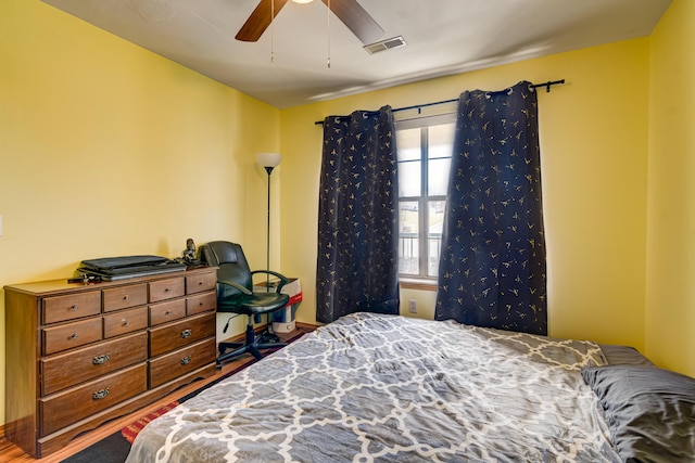 135 Upper Emerald Bay Cir Unit G-13, Hollister, MO 65672 - bedroom with visible vents, a ceiling fan, and wood finished floors