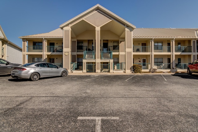135 Upper Emerald Bay Cir Unit G-13, Hollister, MO 65672 - view of building exterior featuring uncovered parking