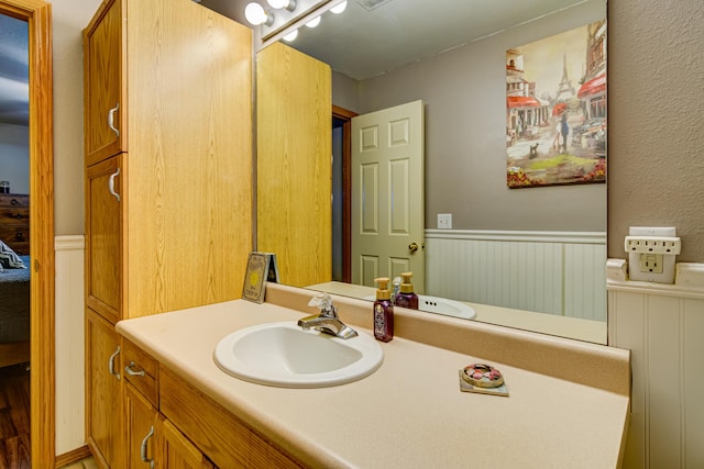 135 Upper Emerald Bay Cir Unit G-13, Hollister, MO 65672 - bathroom with wainscoting and vanity