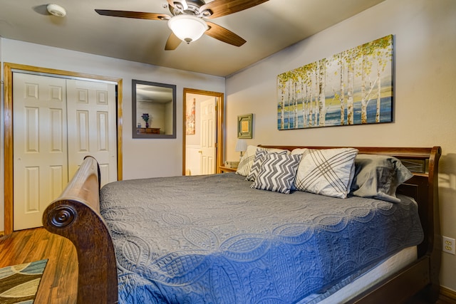 bedroom featuring a closet, hardwood / wood-style floors, and ceiling fan