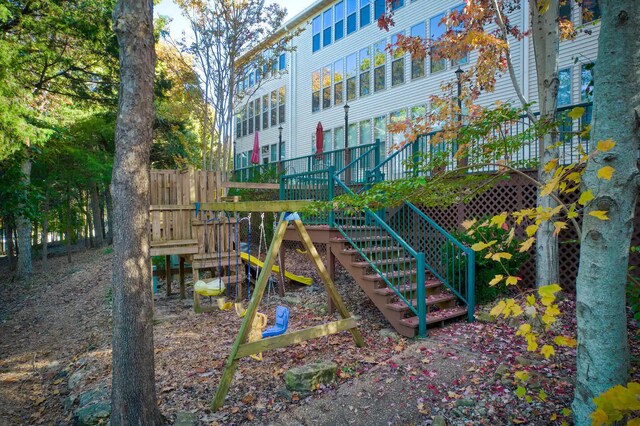 135 Upper Emerald Bay Cir Unit G-13, Hollister, MO 65672 - community play area featuring a deck, fence, and stairway