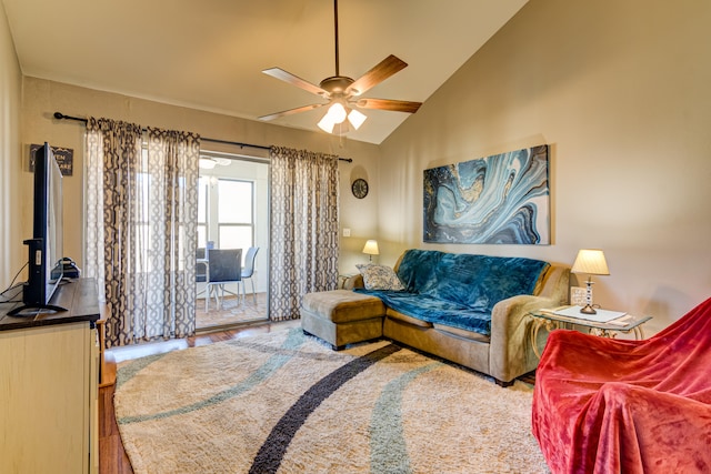 living room with ceiling fan, hardwood / wood-style flooring, and high vaulted ceiling