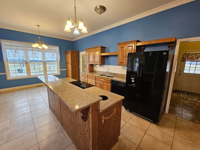 kitchen with a kitchen bar, a wealth of natural light, a chandelier, and black appliances