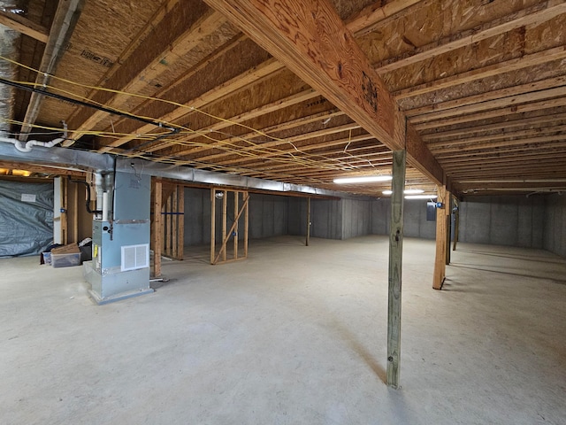 basement featuring heating unit