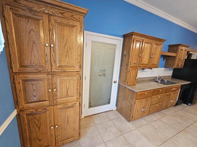 kitchen with light tile patterned flooring, ornamental molding, dishwasher, and sink