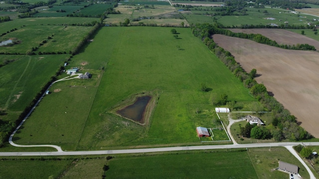 birds eye view of property with a rural view