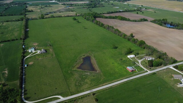 drone / aerial view featuring a water view and a rural view