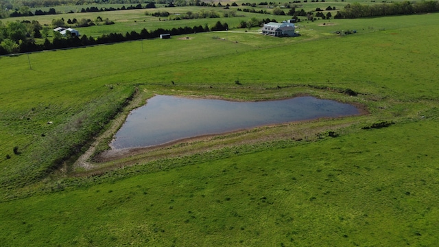 drone / aerial view with a rural view and a water view