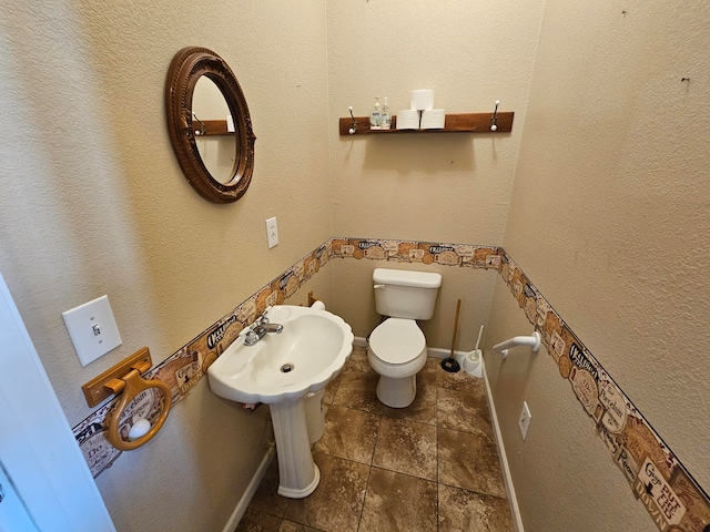 bathroom featuring sink and toilet