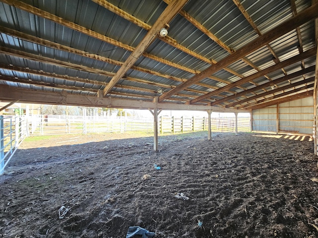 view of horse barn featuring a rural view