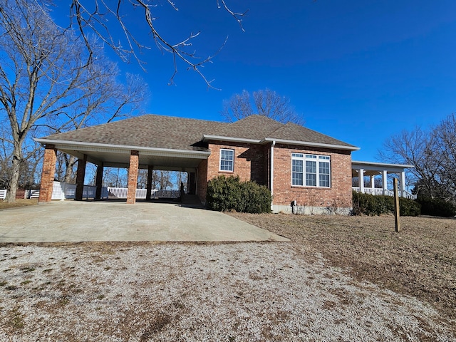 view of front of home featuring a carport