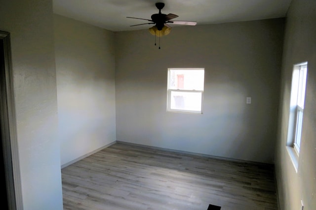 empty room featuring light hardwood / wood-style flooring and ceiling fan