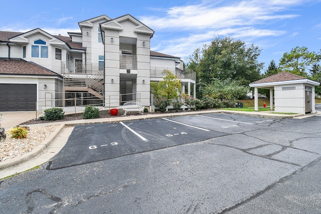 view of car parking with a garage