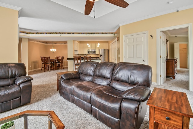 carpeted living room featuring ceiling fan with notable chandelier and crown molding