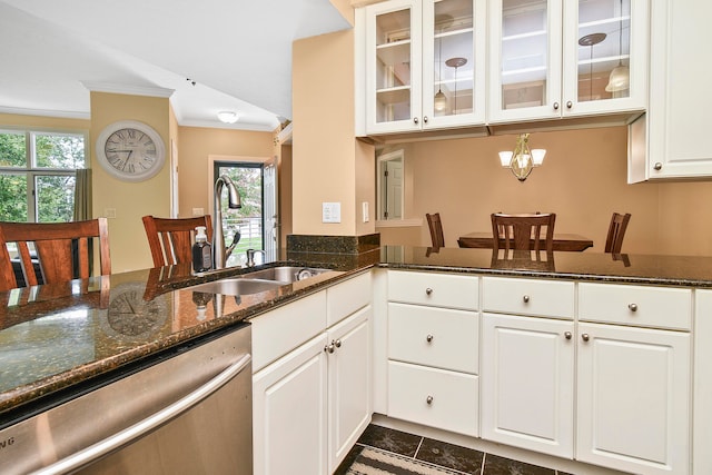 kitchen with white cabinets, ornamental molding, sink, and stainless steel dishwasher