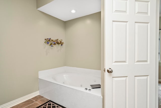 bathroom featuring a bathing tub and tile patterned flooring