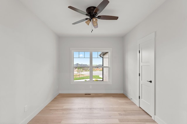 unfurnished room with ceiling fan and light hardwood / wood-style floors