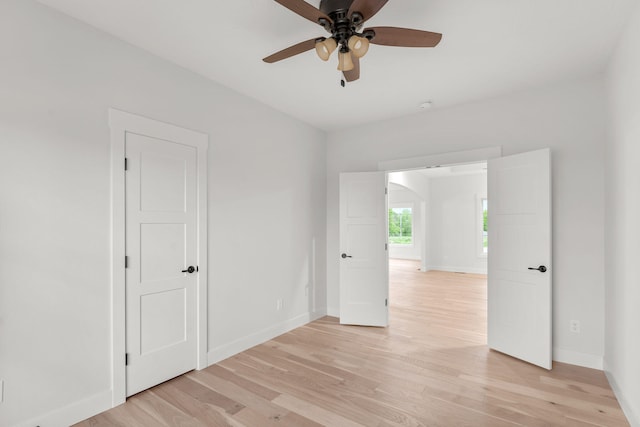 unfurnished room featuring ceiling fan and light hardwood / wood-style floors