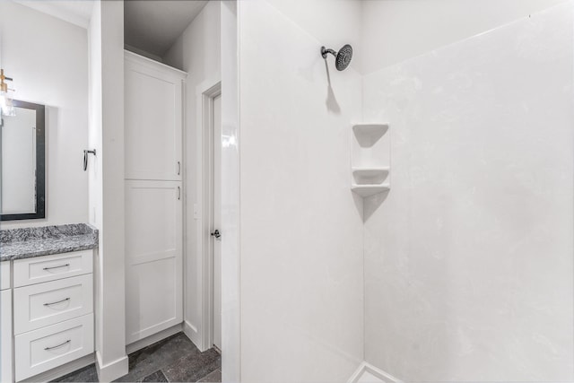 bathroom with a shower and vanity