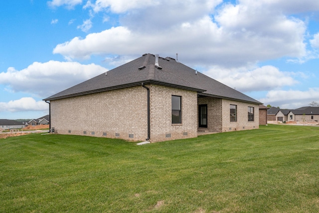 view of property exterior with a yard