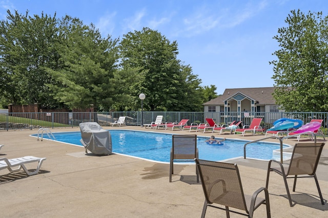 view of swimming pool with a patio area